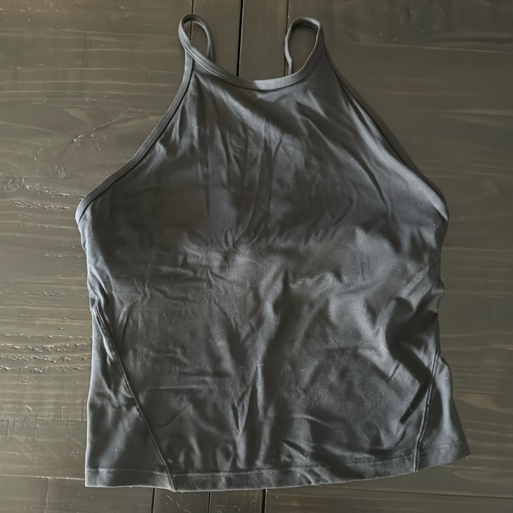 Black lululemon tank. Size unknown tag removed. Measurements shown. Shelf bra.